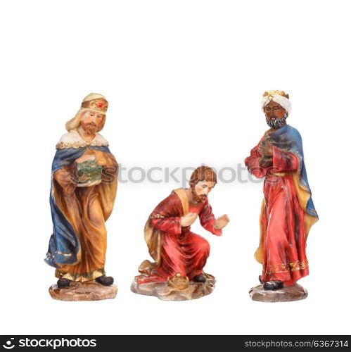 The three wise men. Ceramic figures isolated on white background