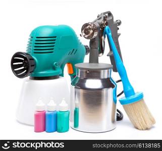 The tool for a painting of surfaces - spray gun electrical and manual mechanical and small bottles with color