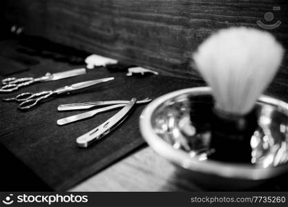 the tools of a Barber on the desktop in front of the mirror
