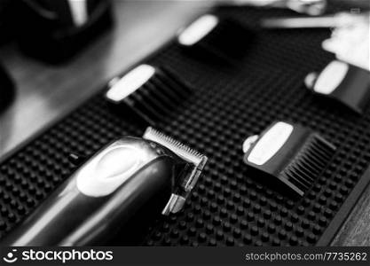 the tools of a Barber on the desktop in front of the mirror