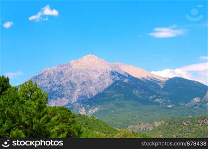 The top of the mountain Olympos (Turkey) against the blue sky. Picturesque and gorgeous scene.