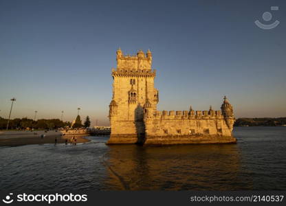 the Torre de Belem or Belem Tower at sunset on the Rio Tejo in Belem near the City of Lisbon in Portugal. Portugal, Lisbon, October, 2021