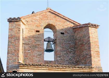 The tower bell of the church of Monteguiduccio a medieval village in the Montefeltro region of Italy, Europe