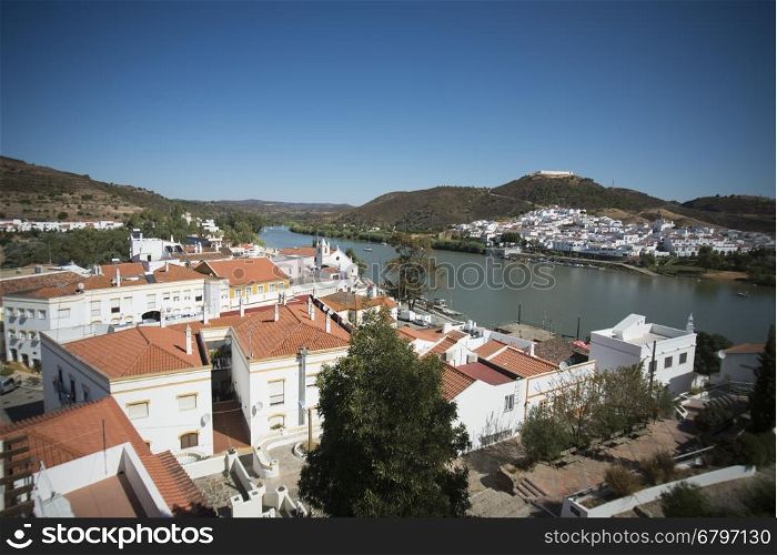 the town Alcoutim in Portugal and the town Sanlucar de Guadiana in Spain at the river Rio Guadiana on the Border of portugal and Spain at the east Algarve in the south of Portugal in Europe.. EUROPE PORTUGAL ALGARVE ALCOUTIM RIO GUADIANA