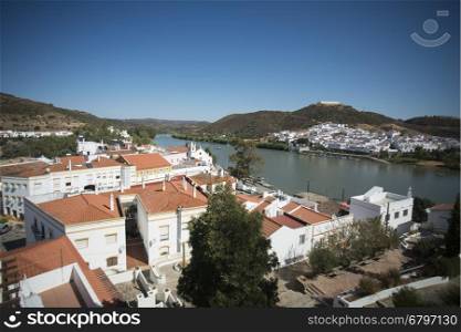 the town Alcoutim in Portugal and the town Sanlucar de Guadiana in Spain at the river Rio Guadiana on the Border of portugal and Spain at the east Algarve in the south of Portugal in Europe.. EUROPE PORTUGAL ALGARVE ALCOUTIM RIO GUADIANA