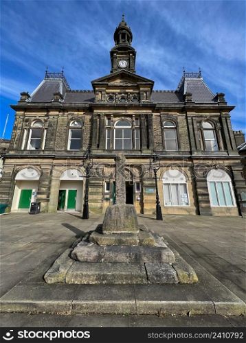 The Town Hall building in Buxton, a spa town in the Borough of High Peak in Derbyshire, England. It is the highest market town in England, at 1,000 feet (300m) above sea level. Buxton Town Hall was opened in 1889 in the Market Place in the towns central Conservation Area.