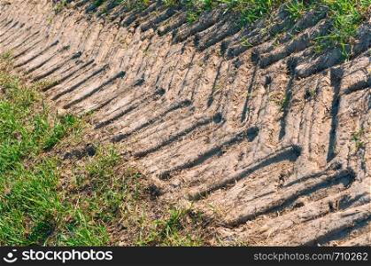 the trace of the tractor, dry soil in the field. dry soil in the field, the trace of the tractor