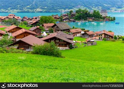 The traditional Swiss village of Iseltwald on the famous lake Brienz. Switzerland.. The Swiss village Iseltwald on the famous lake Brienz.