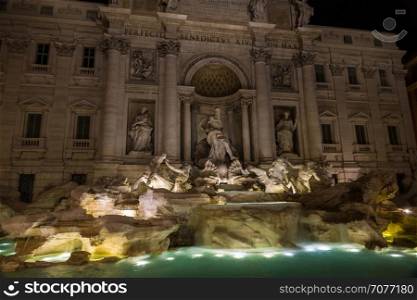 The Trevi Fountain in Rome, Italy at night.