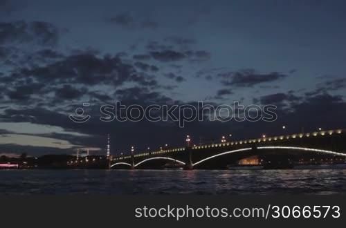 The Troitskiy Bridge in Saint Petersburg at night. Sail across the Neva river. White nights.