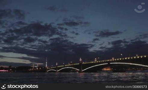 The Troitskiy Bridge in Saint Petersburg at night. Sail across the Neva river. White nights.