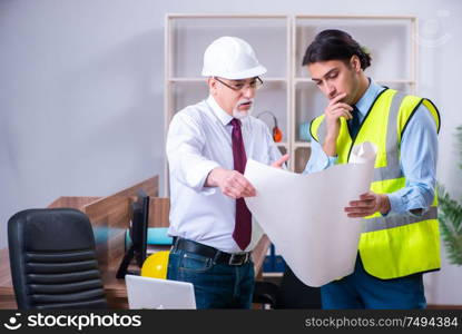 The two architects working on the project. Two architects working on the project