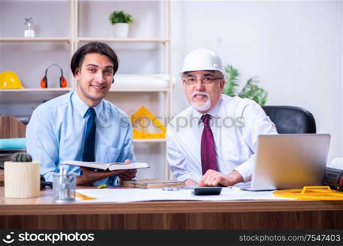 The two architects working on the project. Two architects working on the project