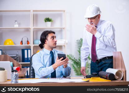 The two architects working on the project. Two architects working on the project