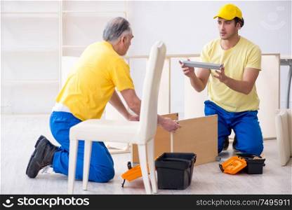 The two contractors carpenters working indoors. Two contractors carpenters working indoors