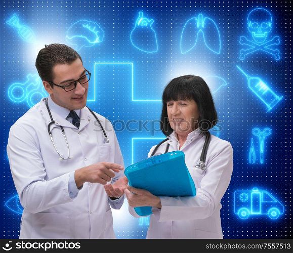 The two doctors discussing issues in telemedicine concept. Two doctors discussing issues in telemedicine concept
