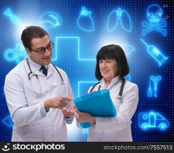 The two doctors discussing issues in telemedicine concept. Two doctors discussing issues in telemedicine concept