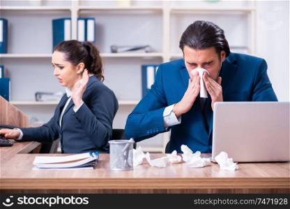 The two employees suffering at workplace . Two employees suffering at workplace 