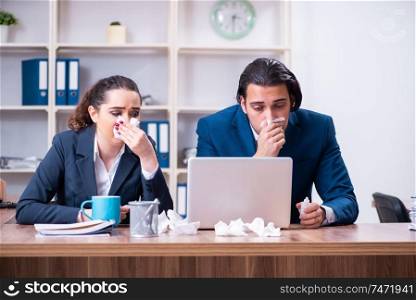 The two employees suffering at workplace . Two employees suffering at workplace 