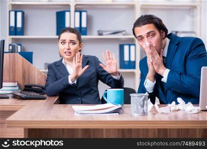 The two employees suffering at workplace . Two employees suffering at workplace
