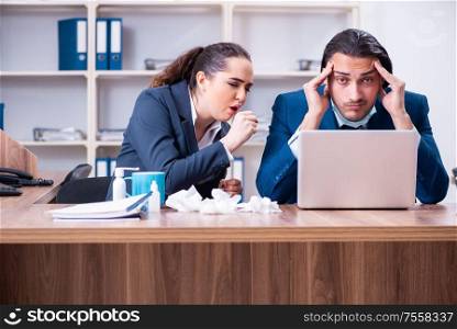 The two employees suffering at workplace. Two employees suffering at workplace
