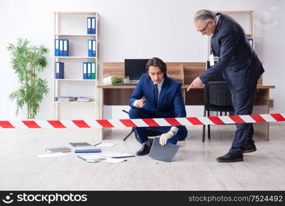 The two experts criminologists working in the office. Two experts criminologists working in the office