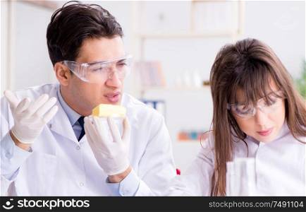 The two lab doctor testing food products. Two lab doctor testing food products