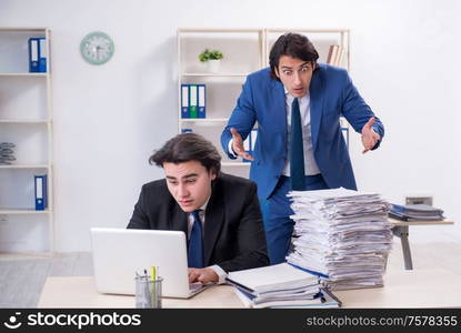 The two male colleagues unhappy with excessive work. Two male colleagues unhappy with excessive work