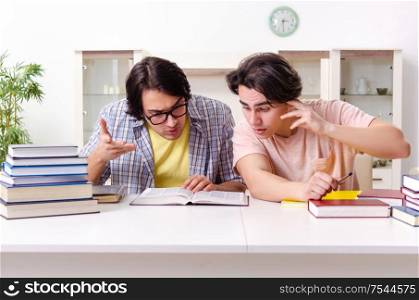 The two male students preparing for exams at home. Two male students preparing for exams at home