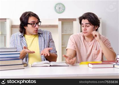 The two male students preparing for exams at home. Two male students preparing for exams at home