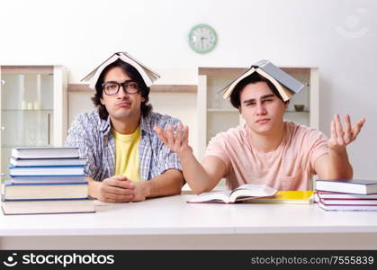 The two male students preparing for exams at home. Two male students preparing for exams at home