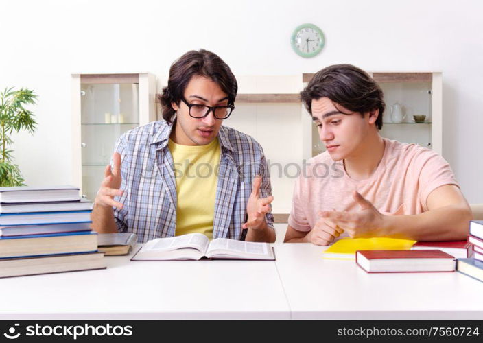 The two male students preparing for exams at home. Two male students preparing for exams at home