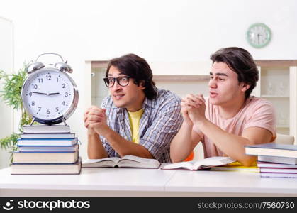 The two male students preparing for exams at home. Two male students preparing for exams at home