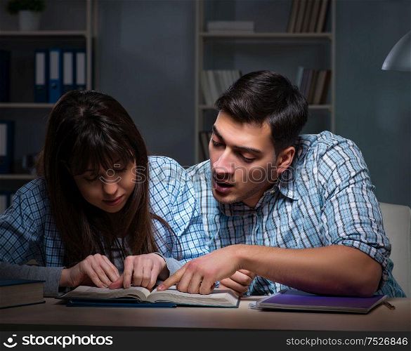 The two students studying late at night. Two students studying late at night