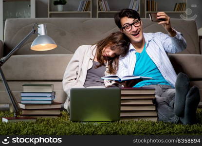 The two students studying late preparing for exams. Two students studying late preparing for exams