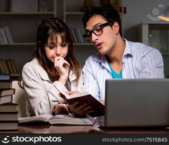 The two students studying late preparing for exams. Two students studying late preparing for exams