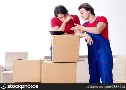 The two young contractor employees moving personal belongings. Two young contractor employees moving personal belongings