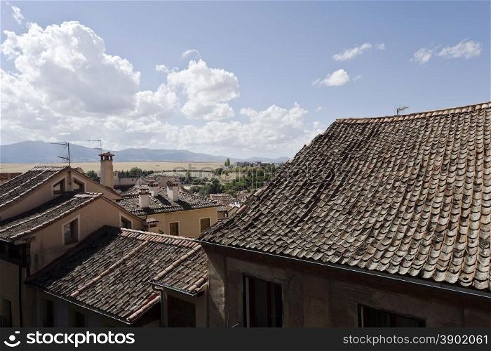 The typical inverted roof tiles of the old city of Segovia, Spain
