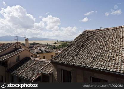 The typical inverted roof tiles of the old city of Segovia, Spain