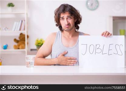 The unemployed man desperate at home. Unemployed man desperate at home