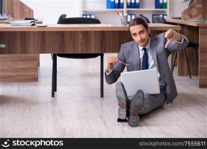 The unhappy male businessman in the office. Unhappy male businessman in the office