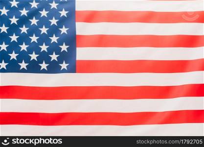 The United States flag flutters in the wind.