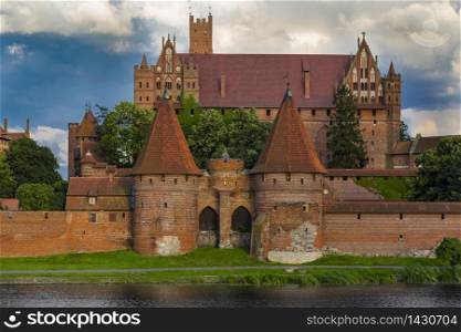 The upper castle and massive towers of the gate of the castle Malbork (Marienburg). Poland