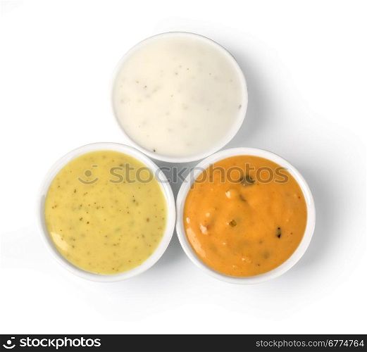 the various barbecue sauces in ceramic bowls with clipping path