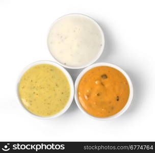 the various barbecue sauces in ceramic bowls with clipping path