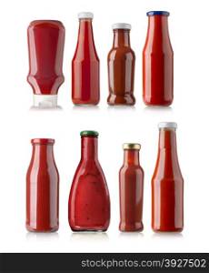 the various barbecue sauces in glass bottles on white background