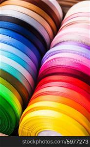 The various colors ribbon bobbins close up. The ribbon bobbins