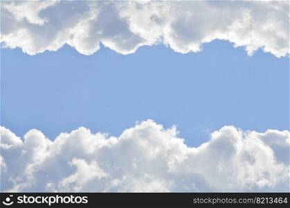 The vast blue sky and thick clouds. Horizontal copy space for text. Template for banners and advertising. Blue sky with white clouds and horizontal text place
