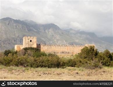 The Venetian-era Frangokastello fortress in Sfakia, on the south coast of Crete, Greece. The castle was constructed in 1371-74 to impose order on the hinterland and deter pirates. It was the scene of a bloody defeat of Greeks by Ottoman forces during the
