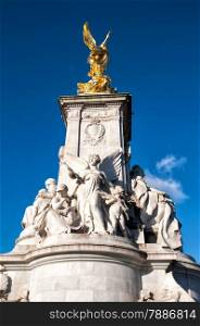 The Victoria Memorial is a sculpture dedicated to Queen Victoria, sculpted by Sir Thomas Brock in London, placed at the centre of Queen&rsquo;s Gardens in front of Buckingham Palace.